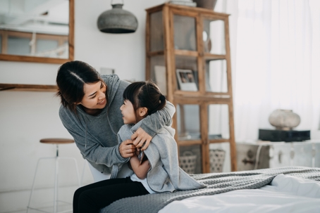 mother and daughter laughing